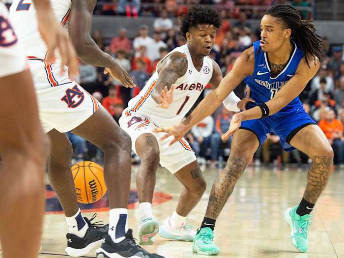 Yuri Collins threads a pass vs. Auburn